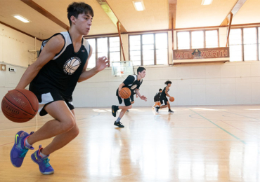 Basketball camper practicing driving